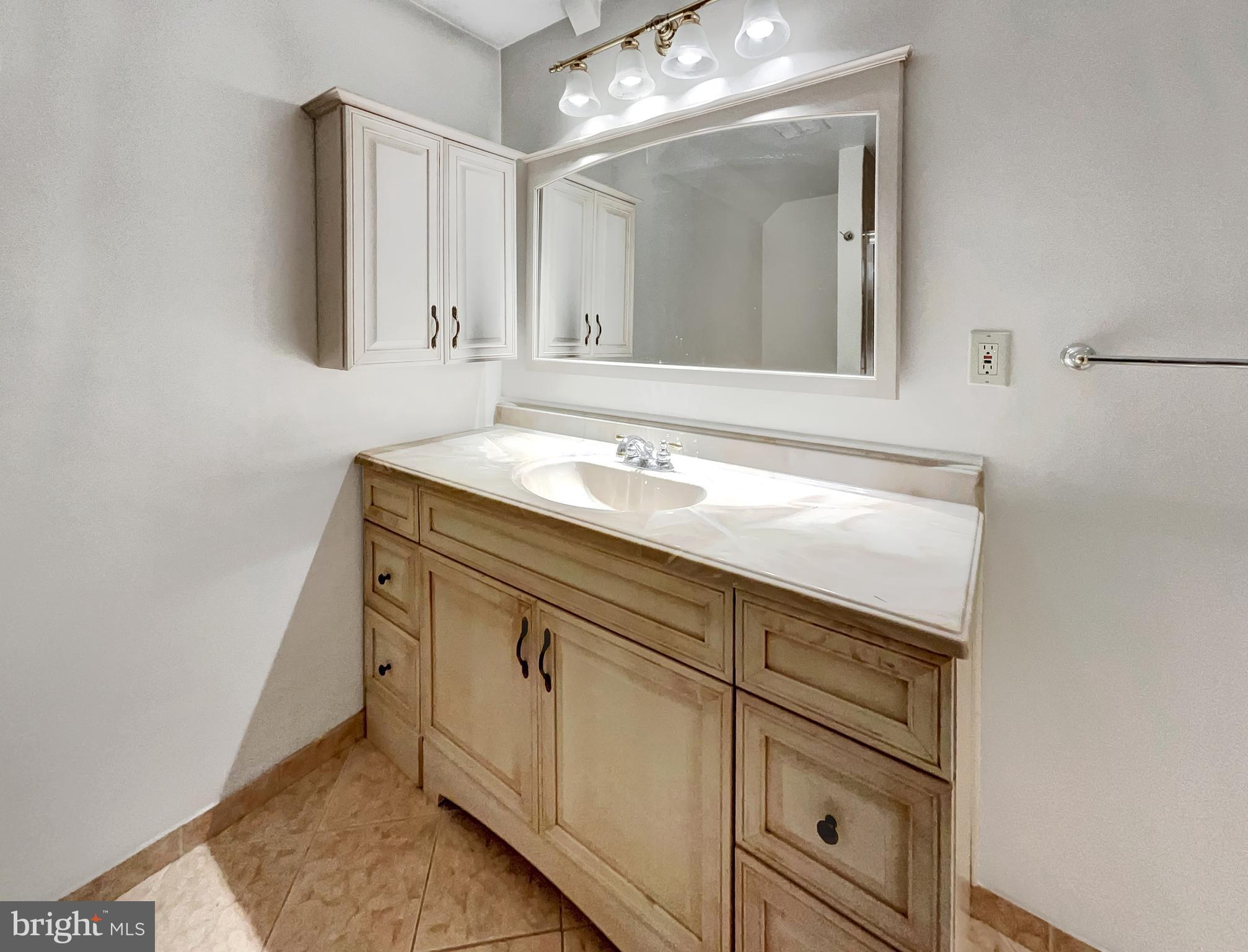 13109 Mica Court Silver Spring, MD 20904 - Photo 24 of 25 a bathroom with a sink and a mirror