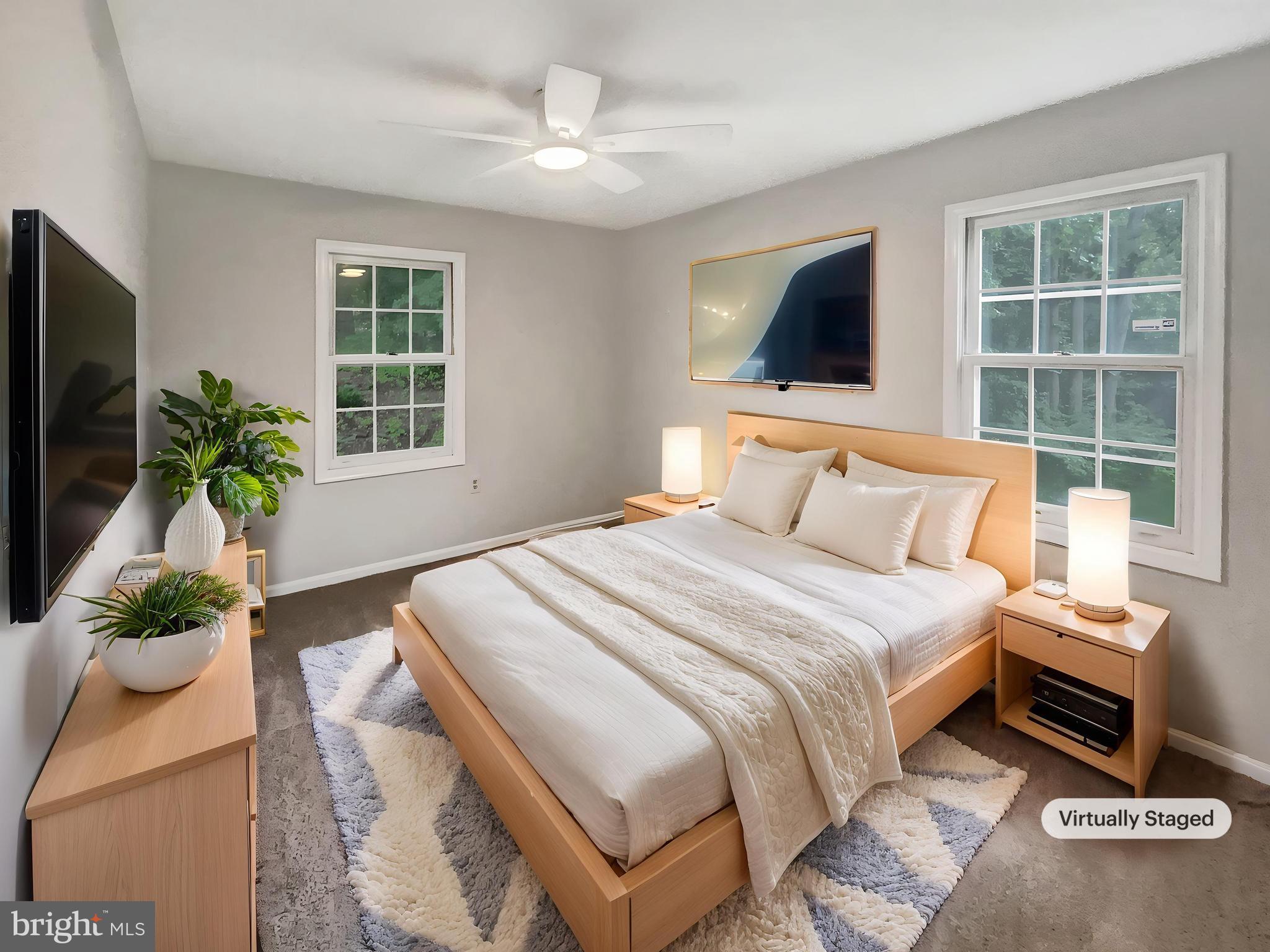 13109 Mica Court Silver Spring, MD 20904 - Photo 4 of 25 a bedroom with a large bed and a flat tv screen on dresser