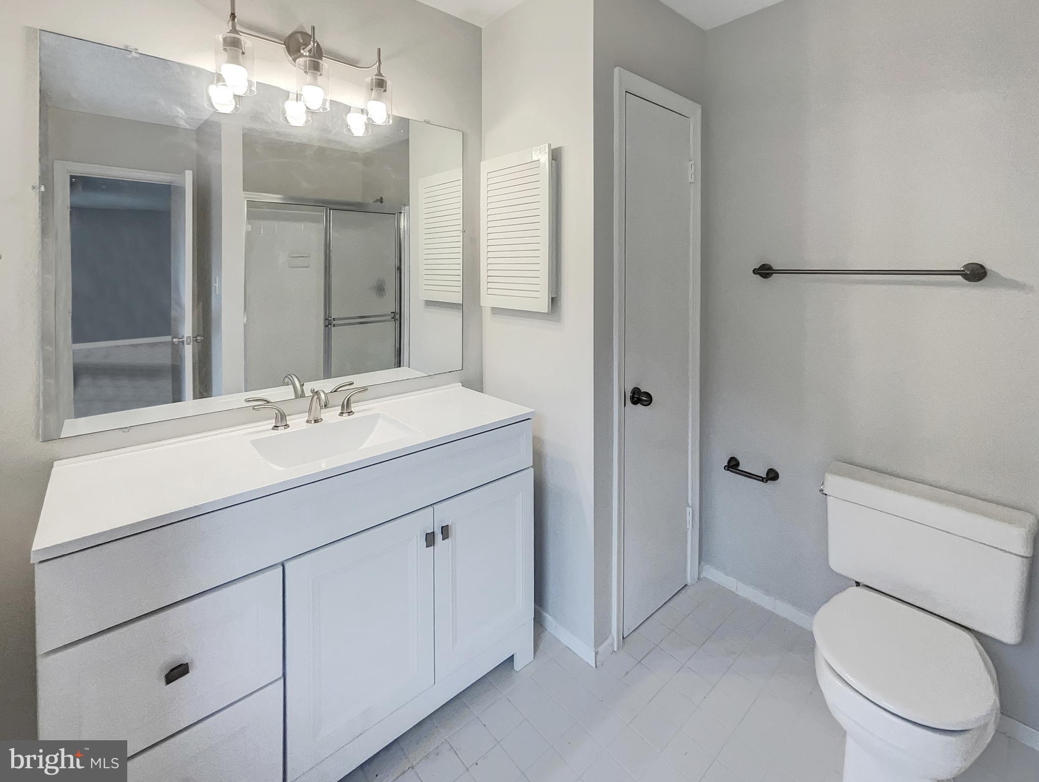 13109 Mica Court Silver Spring, MD 20904 - Photo 7 of 25 a bathroom with a sink a toilet and shower