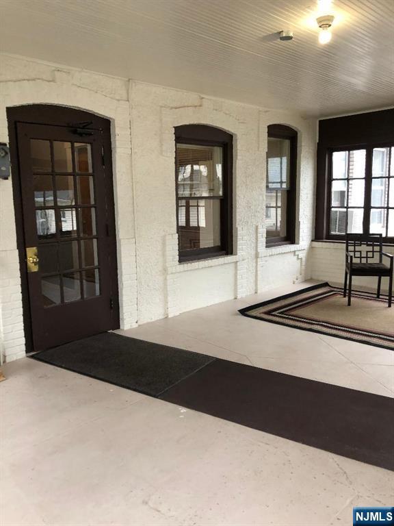 11 Preston Street, Unit 1E Ridgefield Park, NJ 07660 - Photo 3 of 12 a black and white photo of a living room