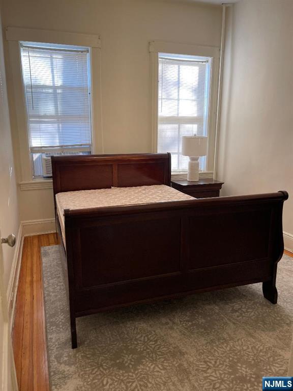 11 Preston Street, Unit 1E Ridgefield Park, NJ 07660 - Photo 5 of 12 a room with a bed and a window