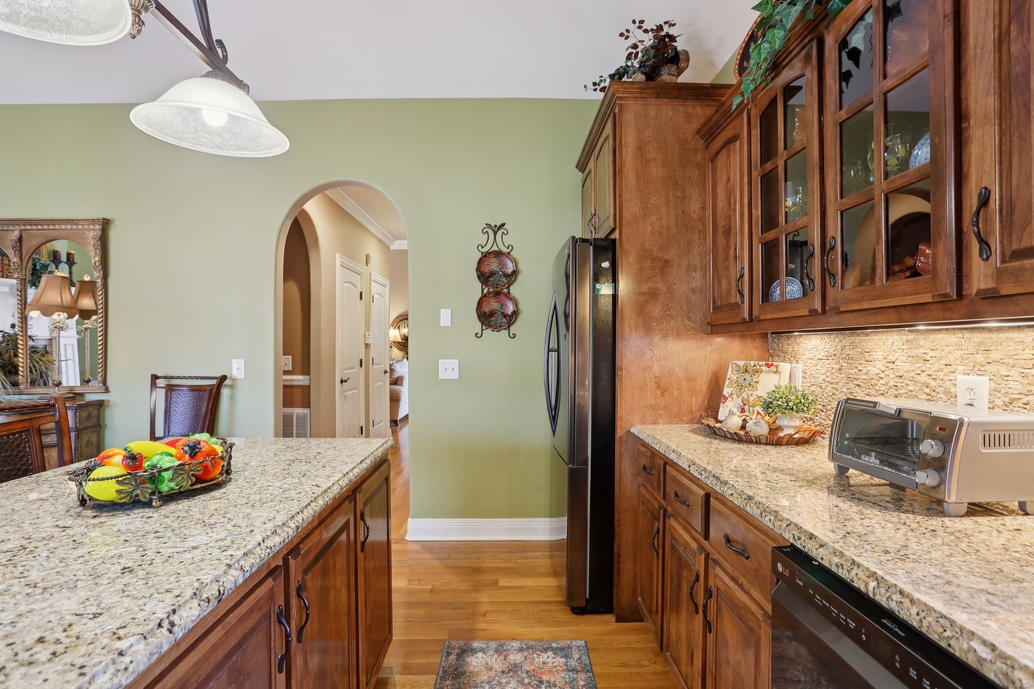4015 Pilgrim Trail Greenbrier, TN 37073 - Photo 21 of 76 a kitchen with stainless steel appliances granite countertop a sink a stove and refrigerator