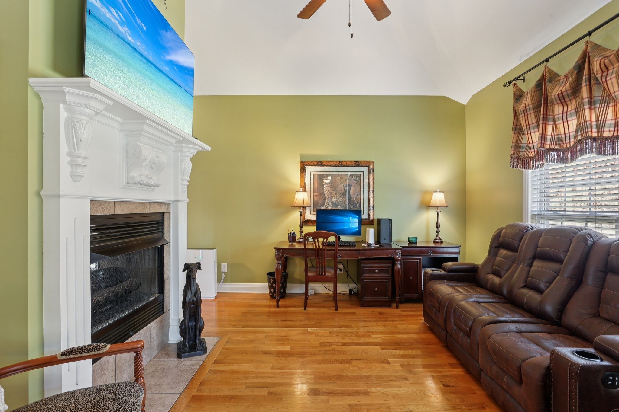 4015 Pilgrim Trail Greenbrier, TN 37073 - Photo 26 of 76 a living room with furniture a fireplace and a flat screen tv