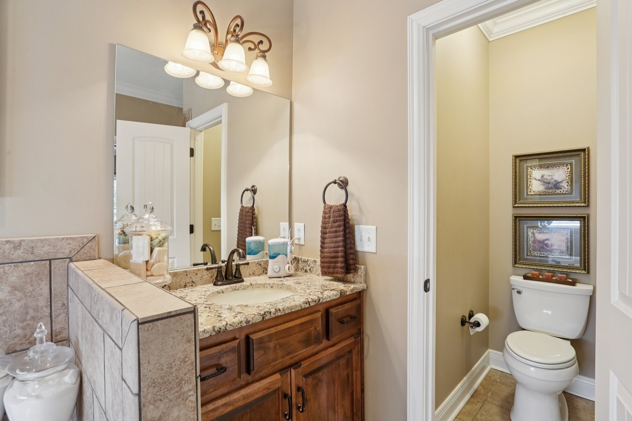 4015 Pilgrim Trail Greenbrier, TN 37073 - Photo 36 of 76 a bathroom with a granite countertop sink a toilet and a mirror