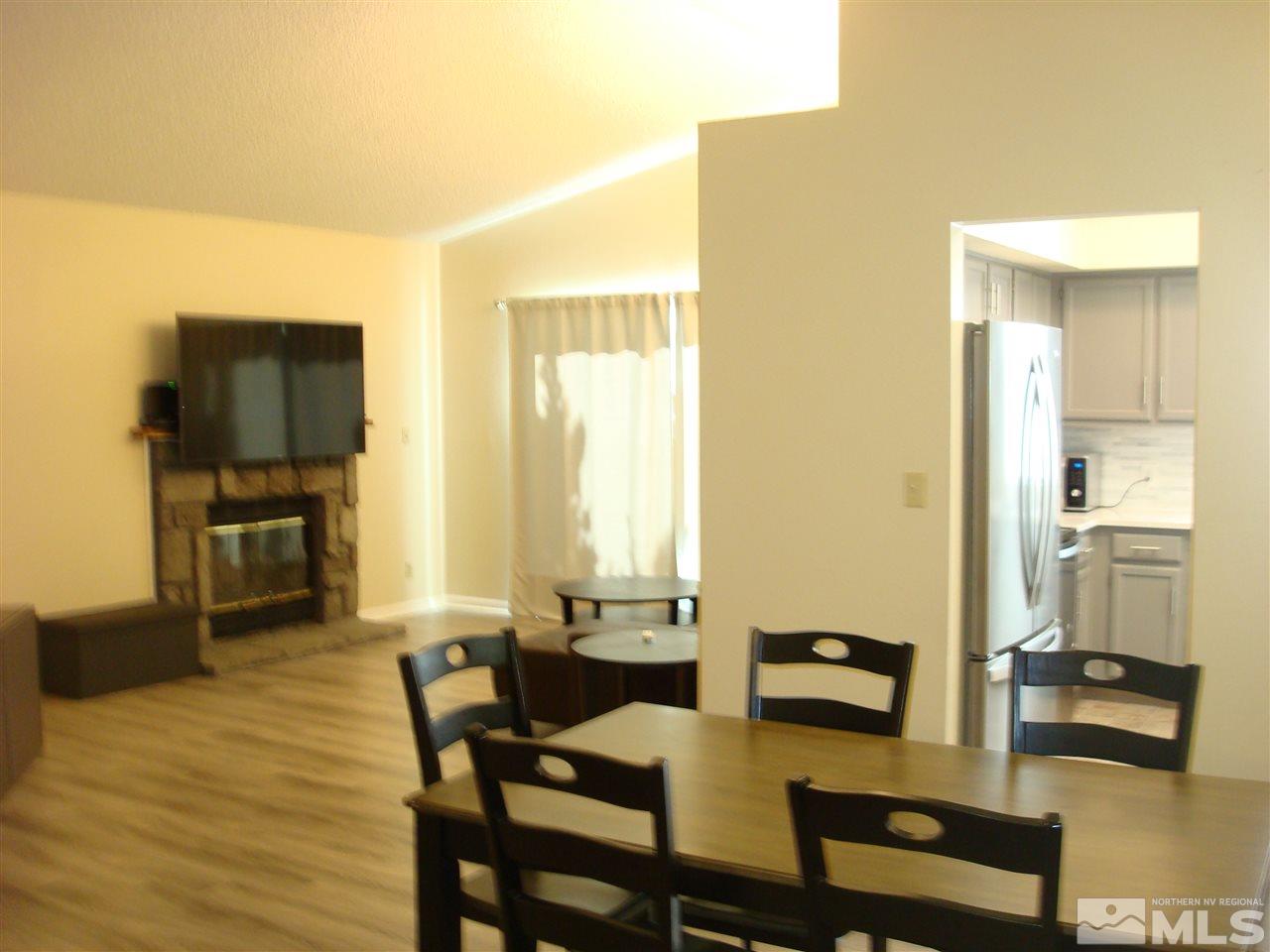 6234 Chesterfield Lane Reno, NV 89523 - Photo 8 of 11 a view of a dining room with furniture and a flat screen tv