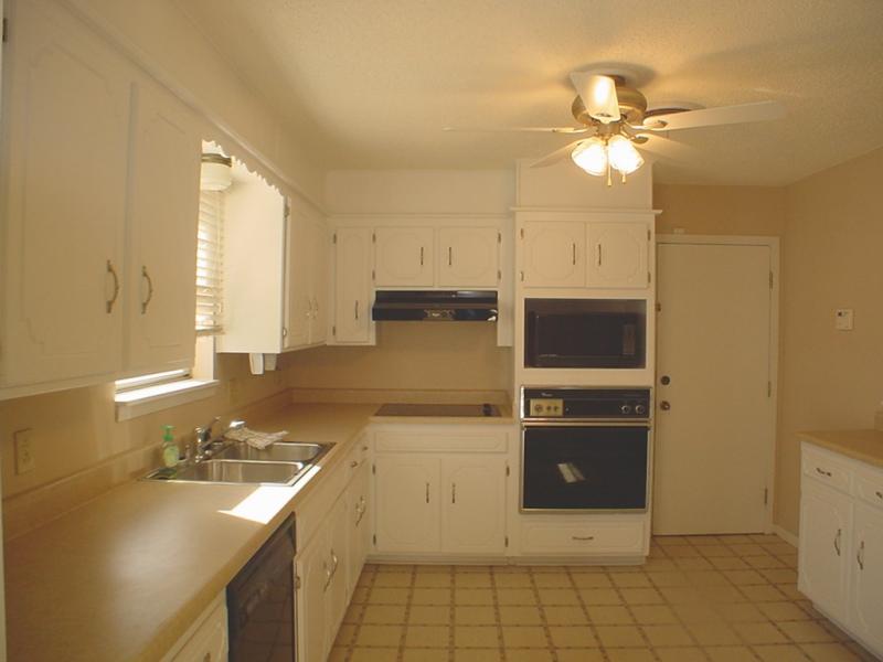 4315 Arden Road Amarillo, TX 79110 - Photo 9 of 11 a view of a kitchen with a sink dishwasher and a refrigerator