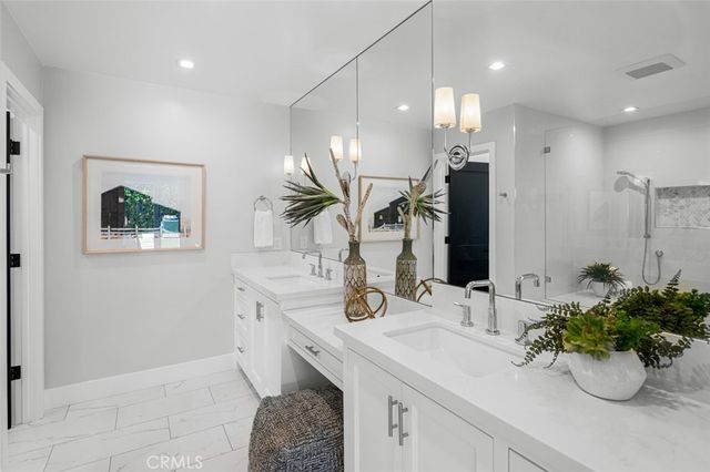 a bathroom with a sink a vanity and a mirror