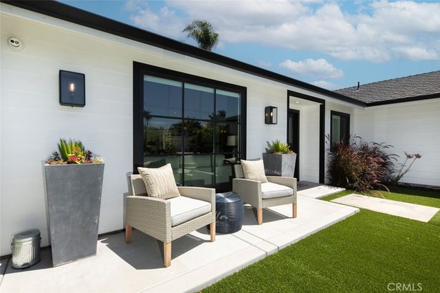 a outdoor living space with furniture and garden view