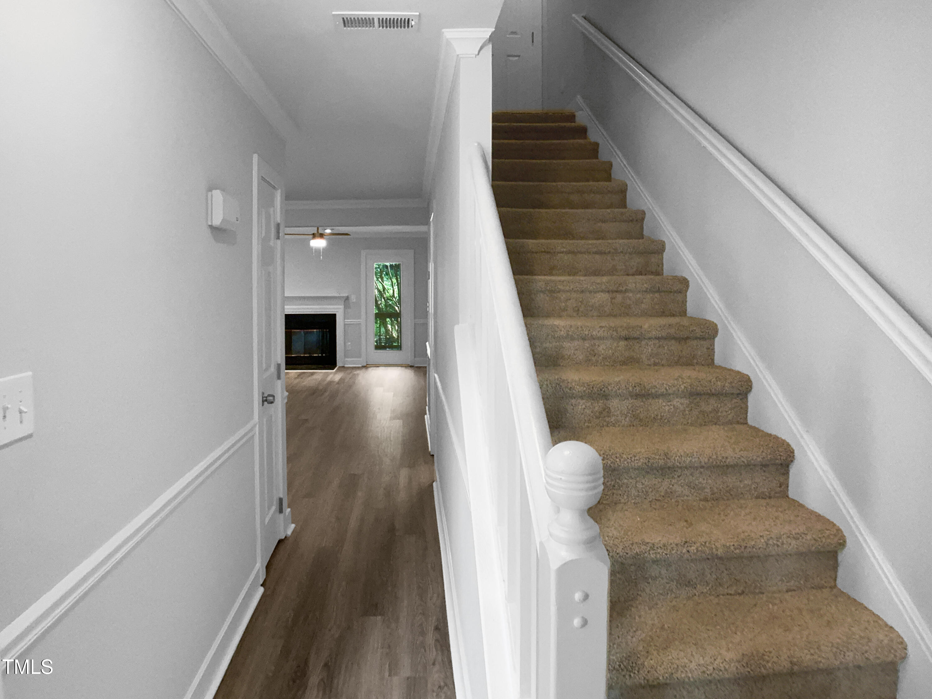 1432 Quarter Point Raleigh, NC 27615 - Photo 12 of 25 a view of entryway and hall with wooden floor