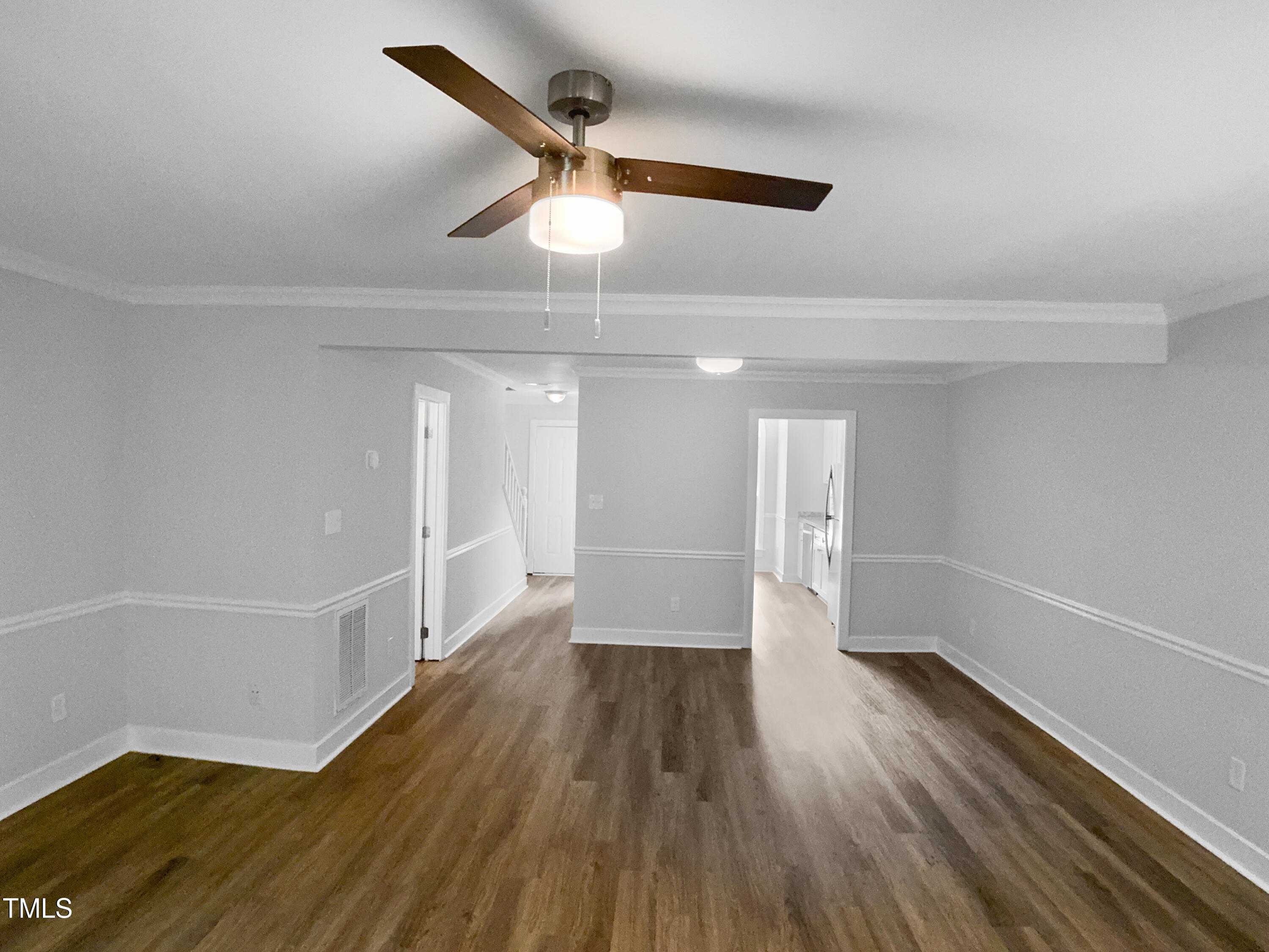 1432 Quarter Point Raleigh, NC 27615 - Photo 14 of 25 wooden floor in an empty room with a window