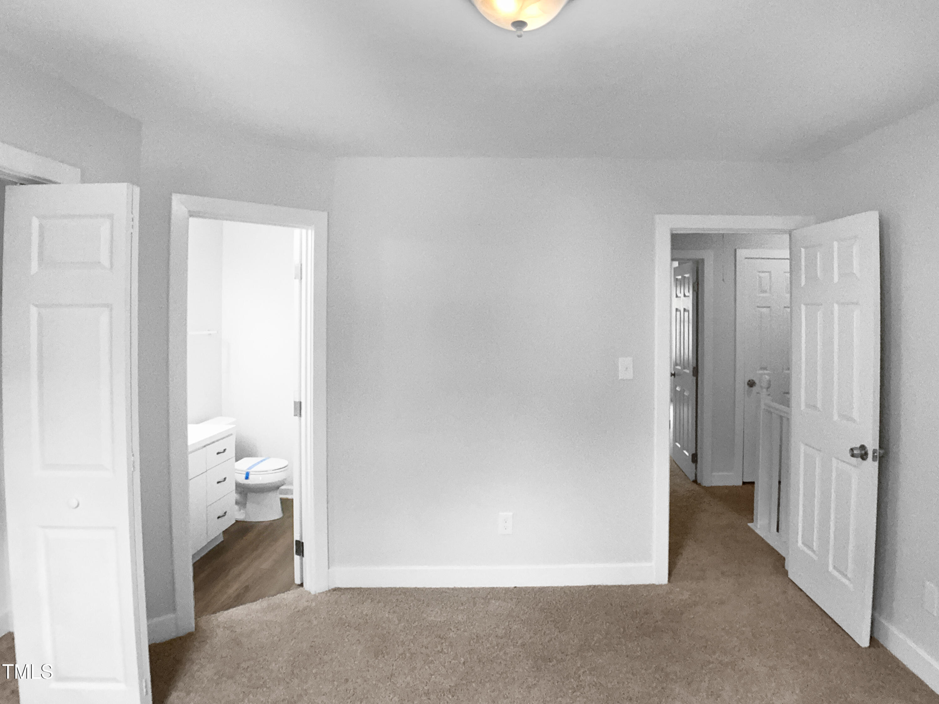 1432 Quarter Point Raleigh, NC 27615 - Photo 22 of 25 a view of room with a hallway