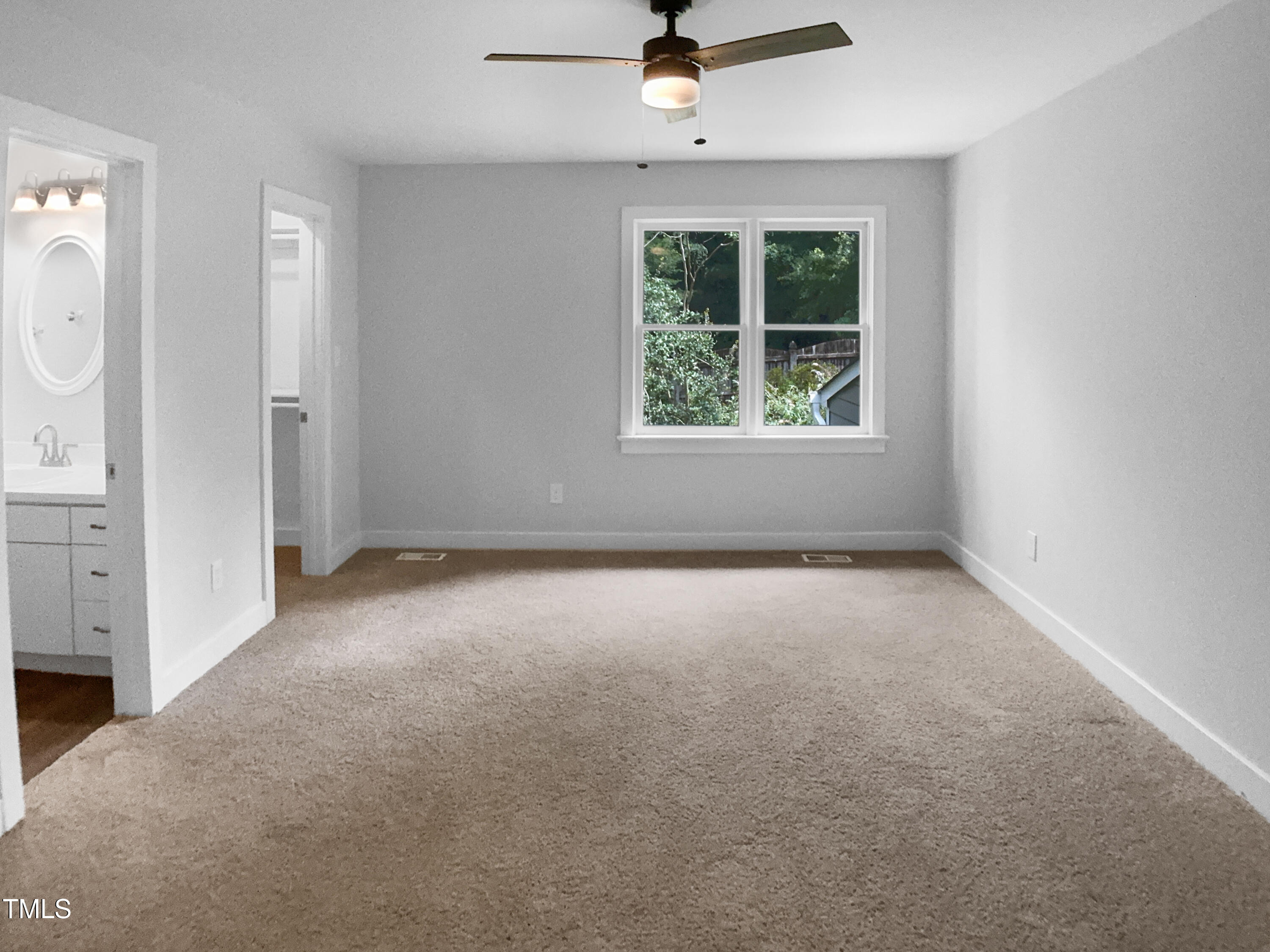 1432 Quarter Point Raleigh, NC 27615 - Photo 5 of 25 an empty room with windows and cabinet
