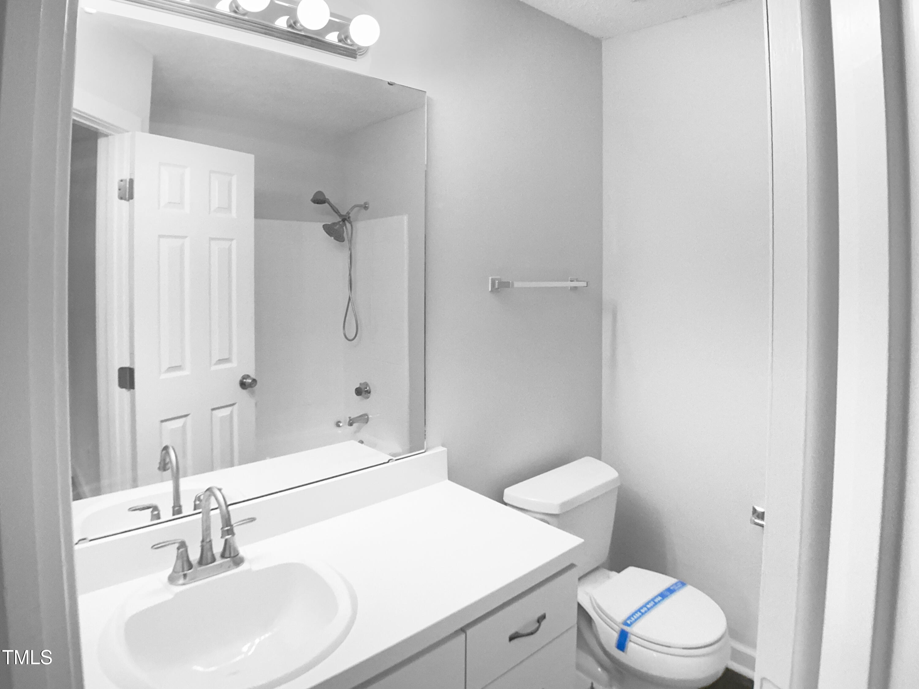 1432 Quarter Point Raleigh, NC 27615 - Photo 7 of 25 a bathroom with a sink toilet vanity and shower