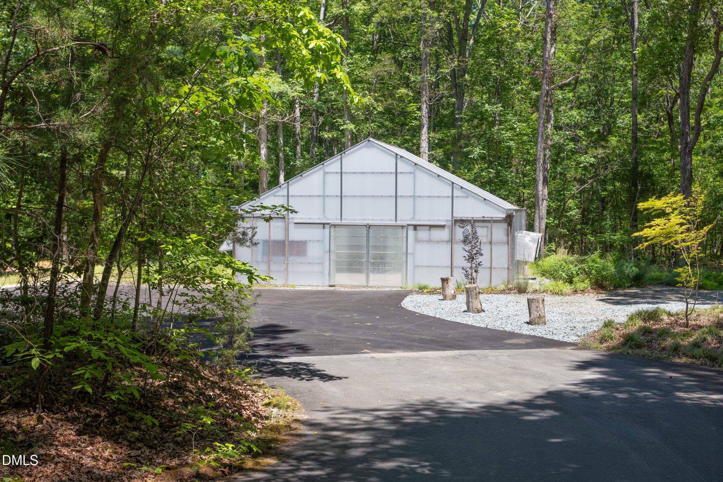 260 Bc Way Rougemont, NC 27572 - Photo 70 of 76 a front view of a house with a yard and garage