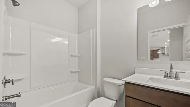 a view of a brick building with a small yard