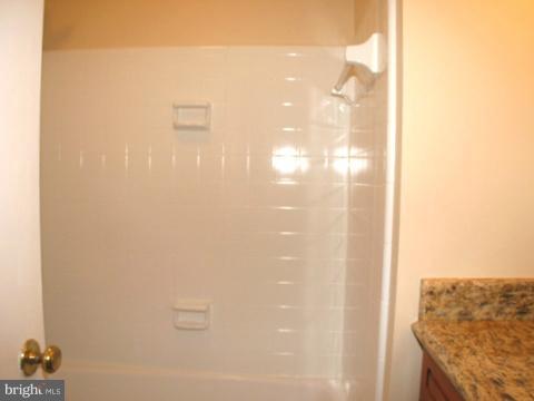 9700 Brookford Road Potomac, MD 20854 - Photo 14 of 29 a bathroom with a shower