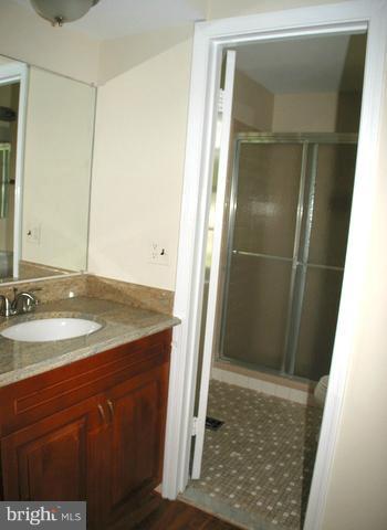 9700 Brookford Road Potomac, MD 20854 - Photo 21 of 29 a bathroom with a sink and a mirror