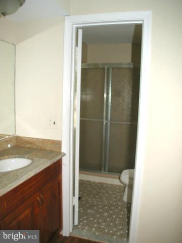 9700 Brookford Road Potomac, MD 20854 - Photo 22 of 29 a bathroom with a granite countertop sink and a mirror