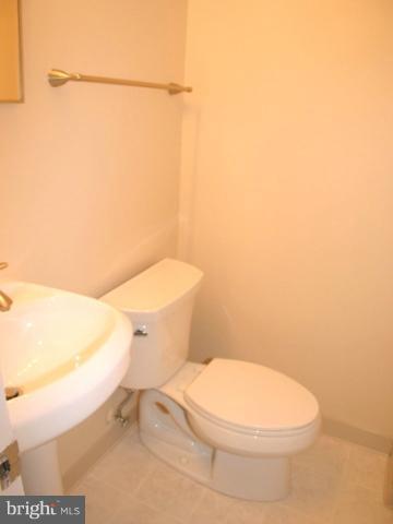 9700 Brookford Road Potomac, MD 20854 - Photo 25 of 29 a white toilet sitting next to a white wall