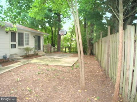 9700 Brookford Road Potomac, MD 20854 - Photo 28 of 29 a view of a house with backyard and tree