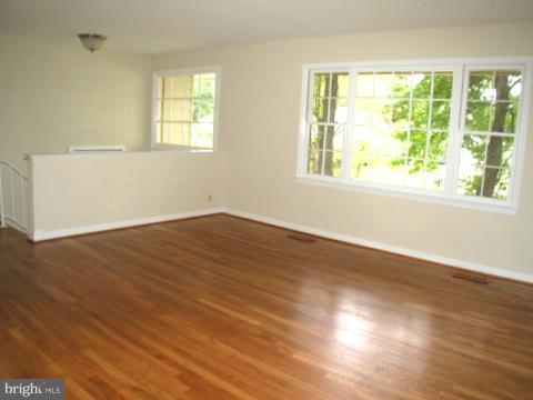 9700 Brookford Road Potomac, MD 20854 - Photo 7 of 29 a view of a big room with wooden floor and windows in a room