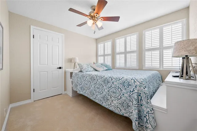 a view of a patio with a table and chairs