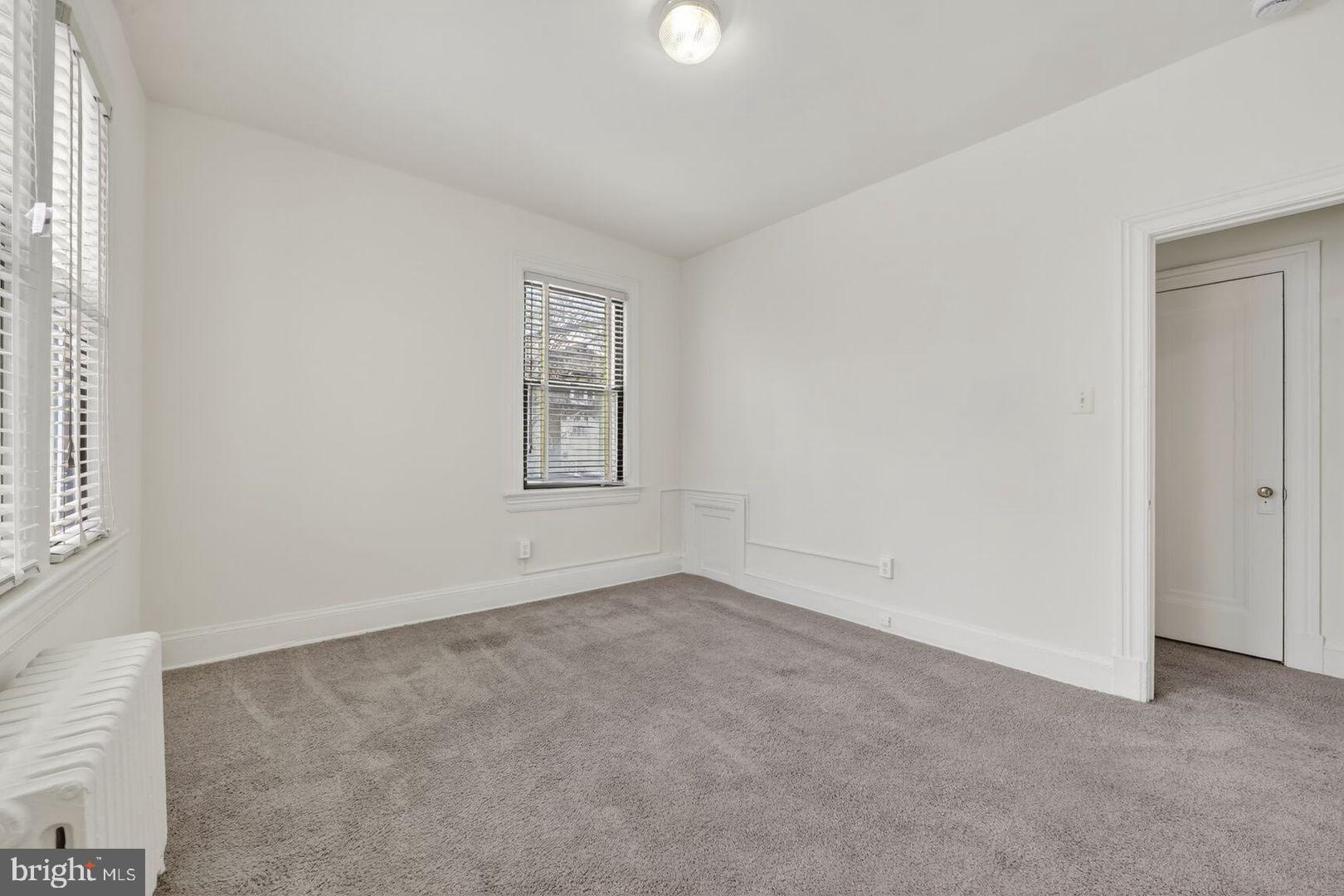 5400 7th Street Northwest, Unit 102 Washington, DC 20011 - Photo 6 of 7 an empty room with windows