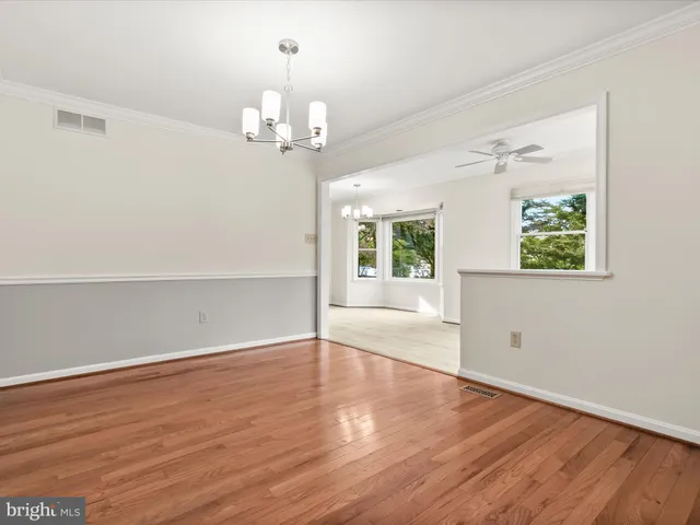 a view of balcony with wooden floor and fence