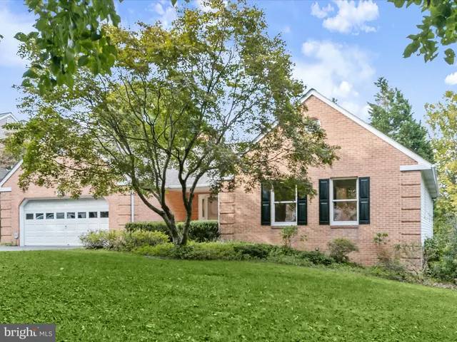 a front view of house with a garden