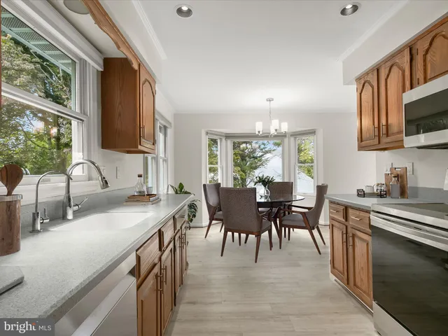 a view of a kitchen with granite countertop a fireplace