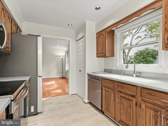 a spacious bedroom with a bed and glass window