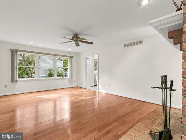 a bathroom with a shower sink mirror and toilet