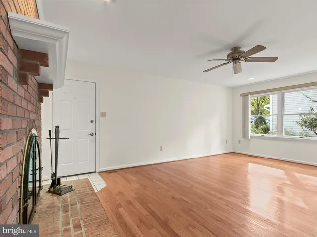 a bathroom with a granite countertop sink mirror and shower