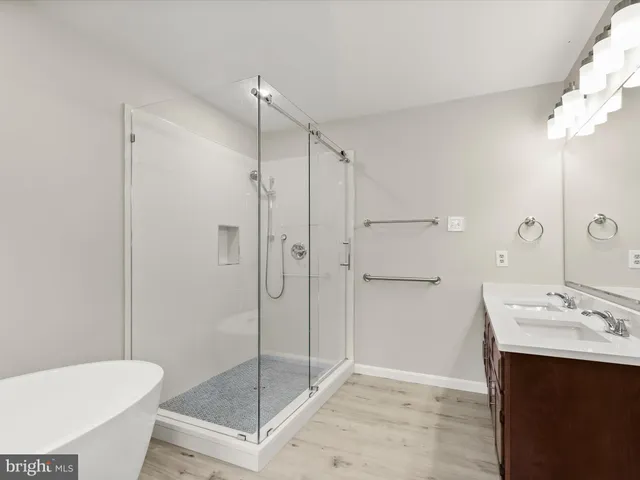 a view of a room with wooden floor