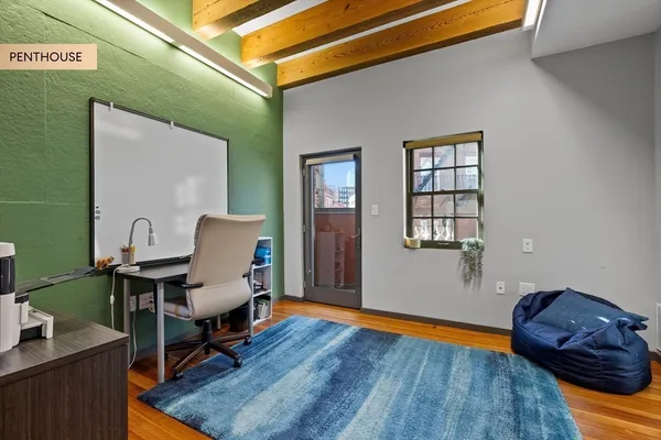 a workspace with furniture and wooden floor