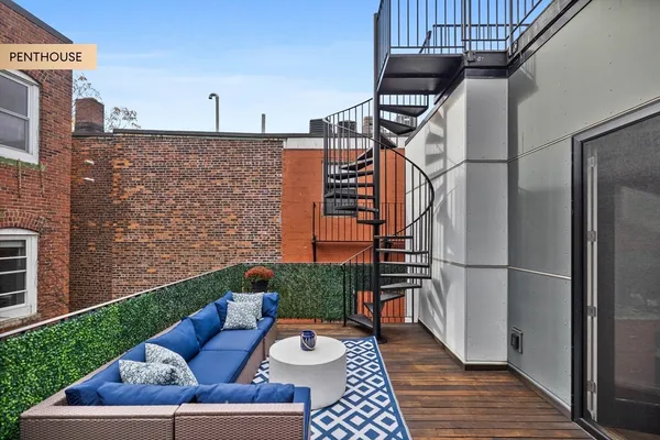 a view of backyard with seating space