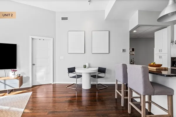 a workspace with furniture and wooden floor