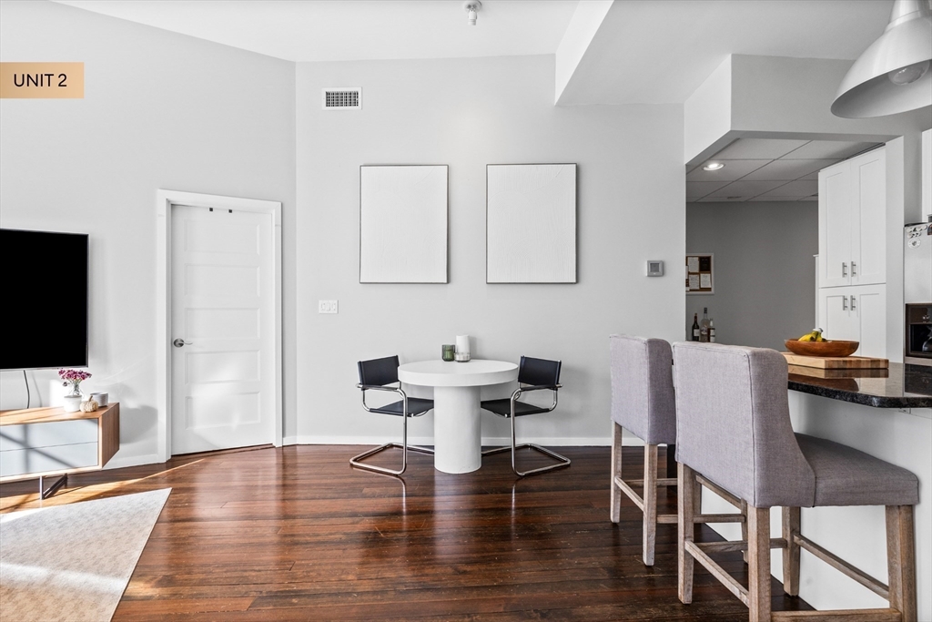 133 Salem Street Boston, MA 02113 - Photo 20 of 27 a workspace with furniture and wooden floor