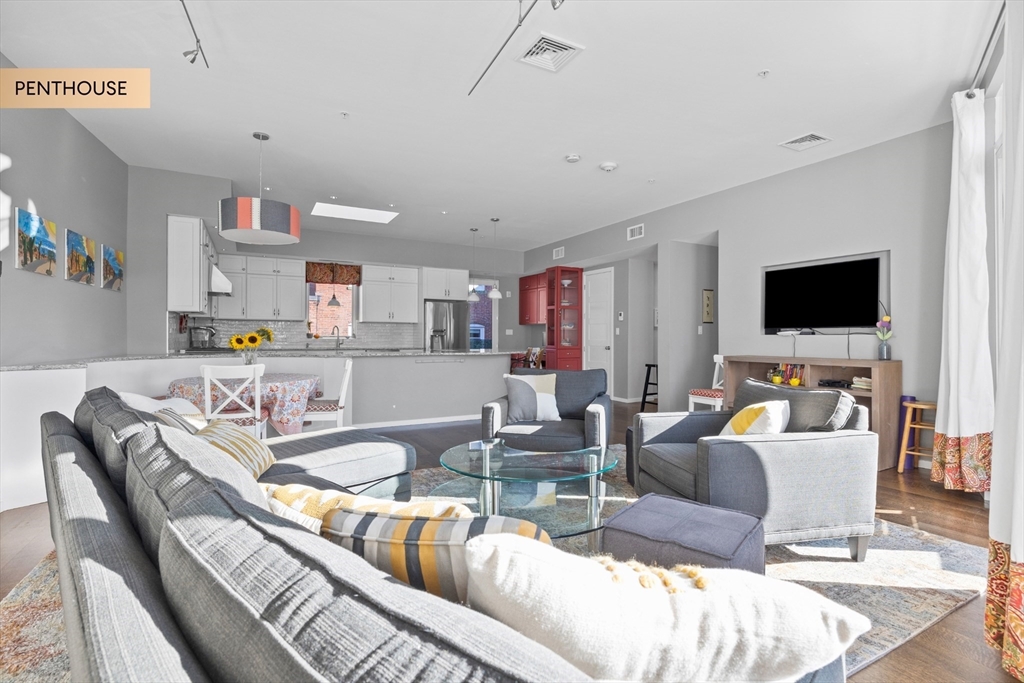 133 Salem Street Boston, MA 02113 - Photo 4 of 27 a living room with furniture and a flat screen tv