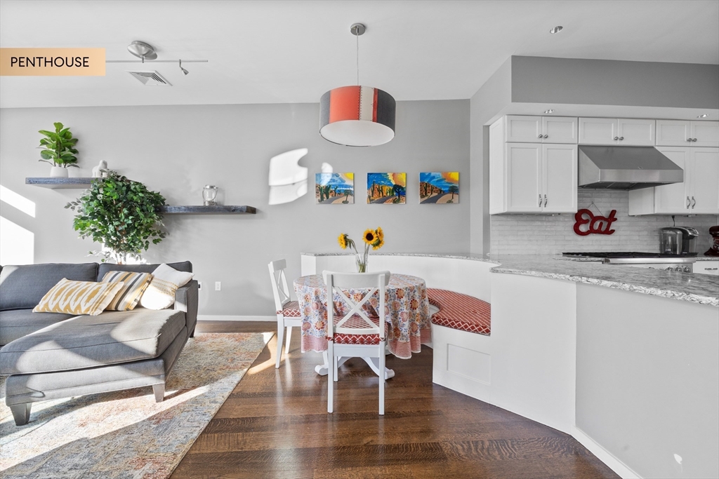 133 Salem Street Boston, MA 02113 - Photo 6 of 27 a dining room with furniture and a wooden floor