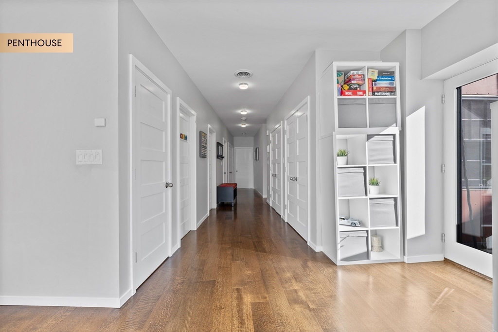 133 Salem Street Boston, MA 02113 - Photo 9 of 27 a view of a hallway with wooden floor and entryway