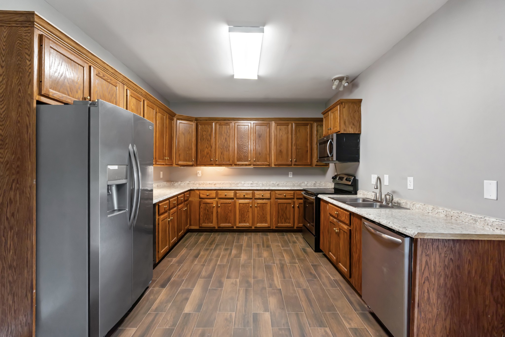 4602 Washington Road Springfield, TN 37172 - Photo 15 of 63 a kitchen with a sink refrigerator and microwave
