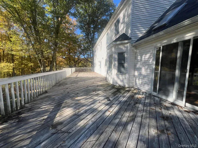 a view of outdoor space with wooden floor