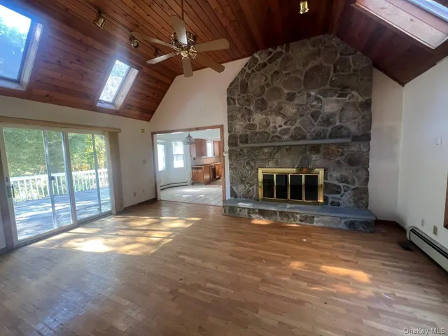 a view of livingroom with furniture and floor to ceiling window