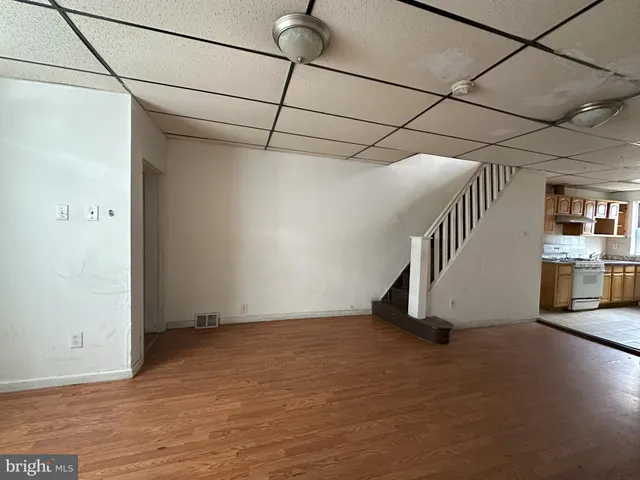 a view of a room with stairs and windows