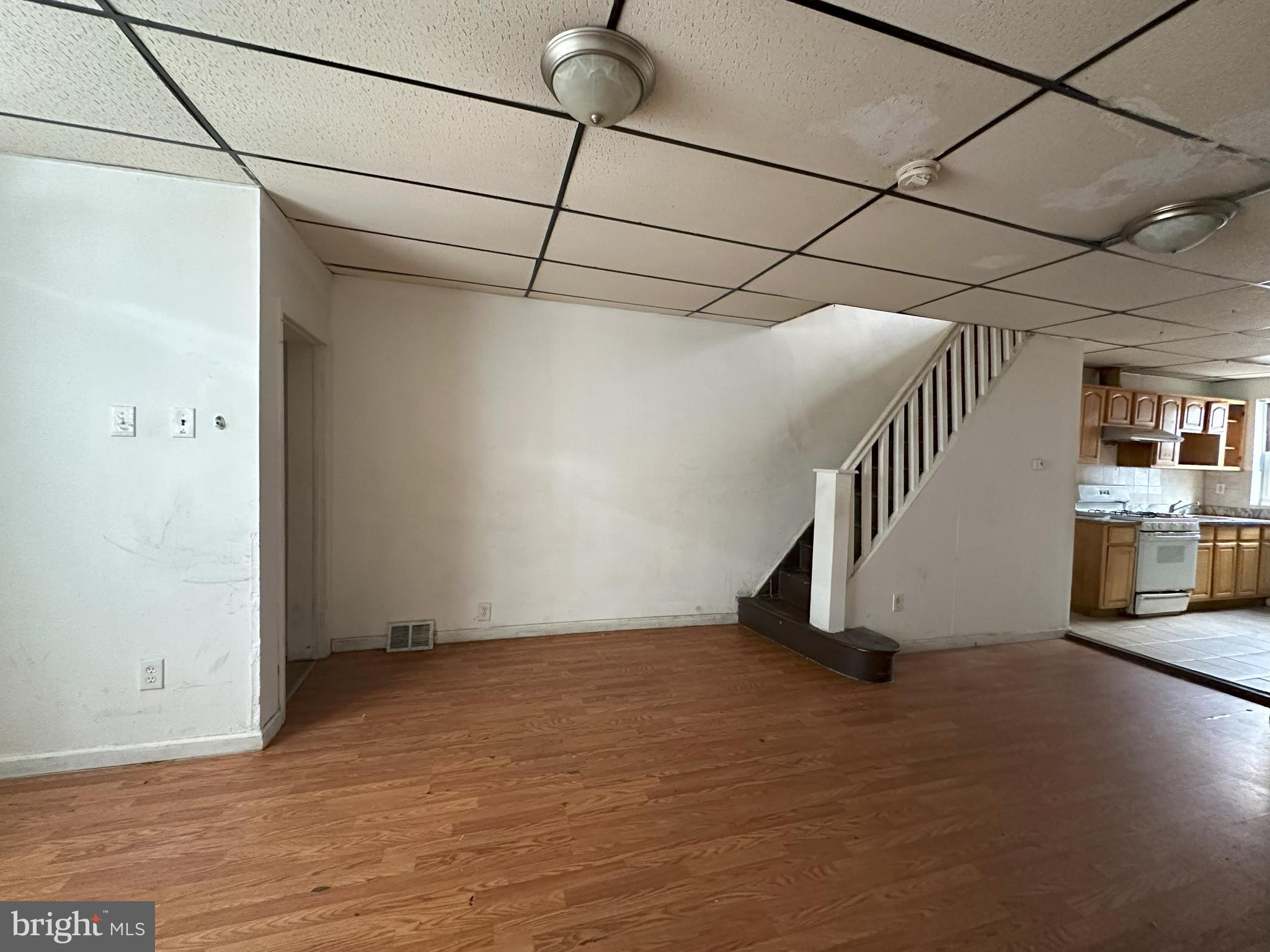 2539 South Marshall Street Philadelphia, PA 19148 - Photo 4 of 13 a view of a room with stairs and windows