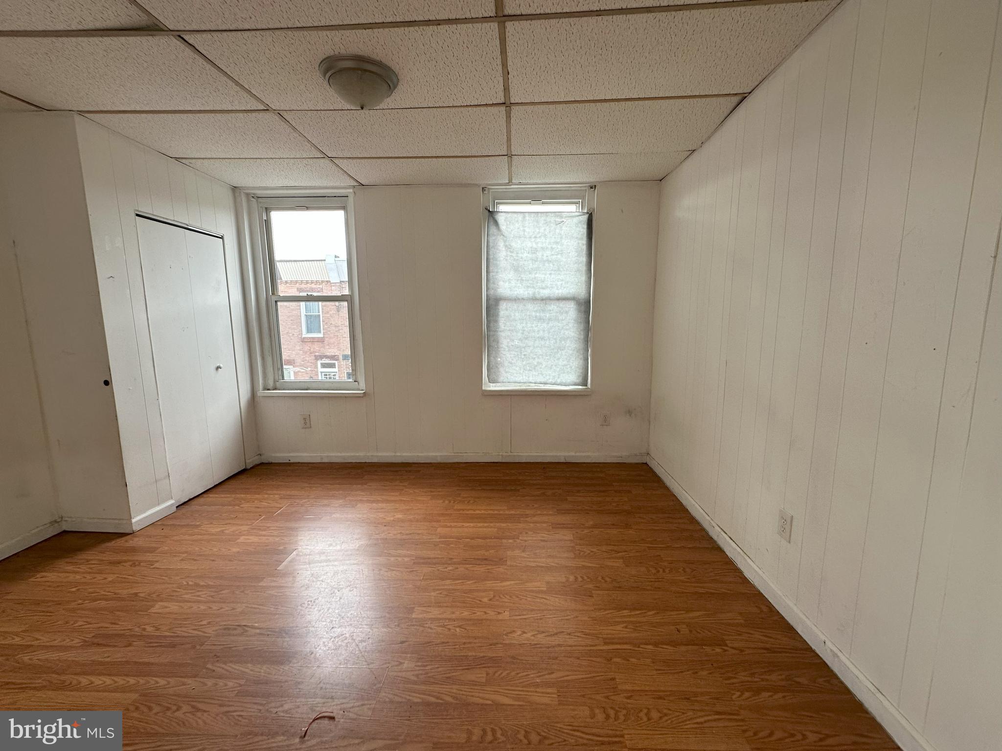 2539 South Marshall Street Philadelphia, PA 19148 - Photo 7 of 13 an empty room with wooden floor and windows