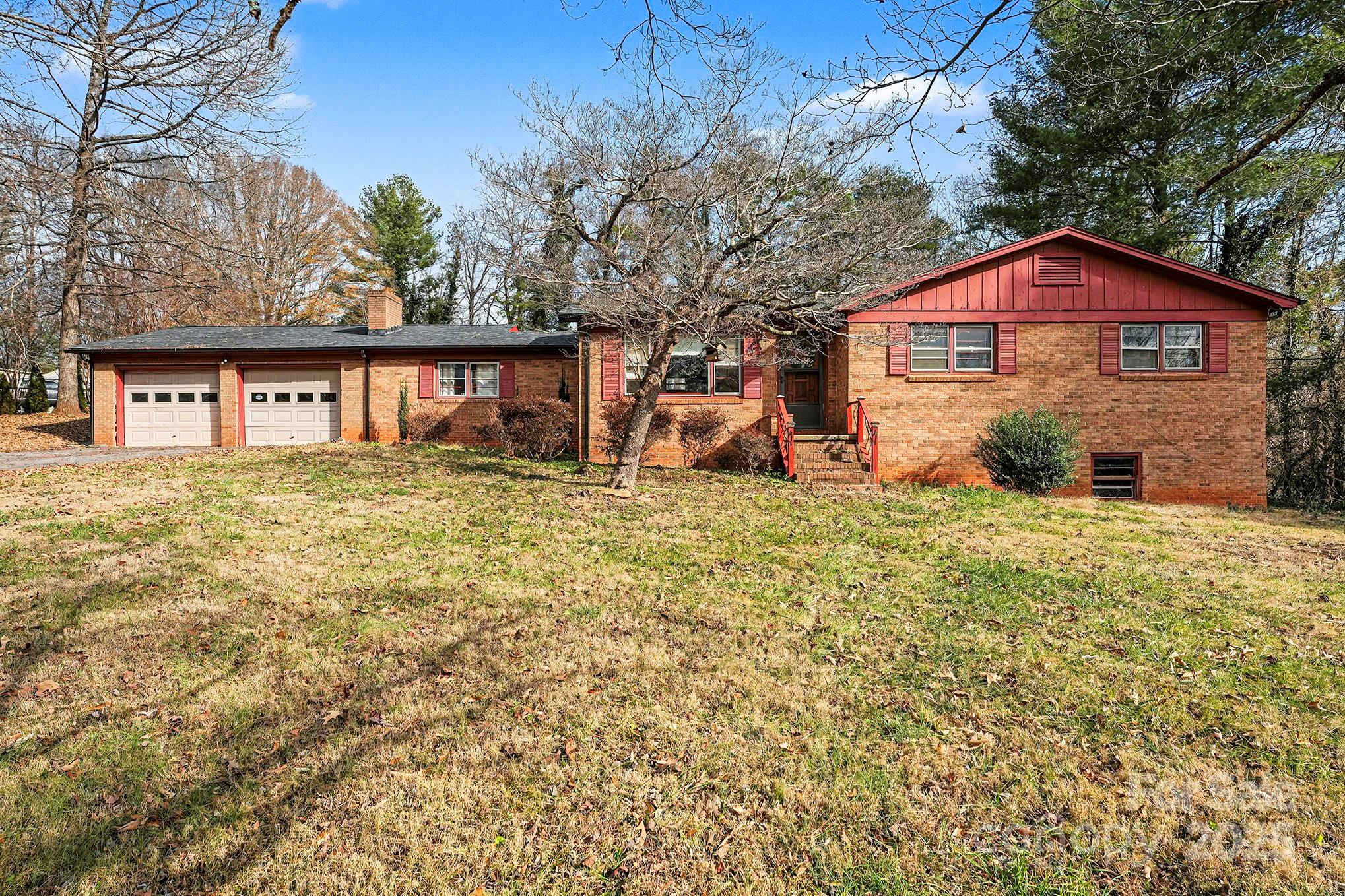 3442 Lester Street Conover, NC 28613 - Photo 1 of 38 a view of a house with a yard