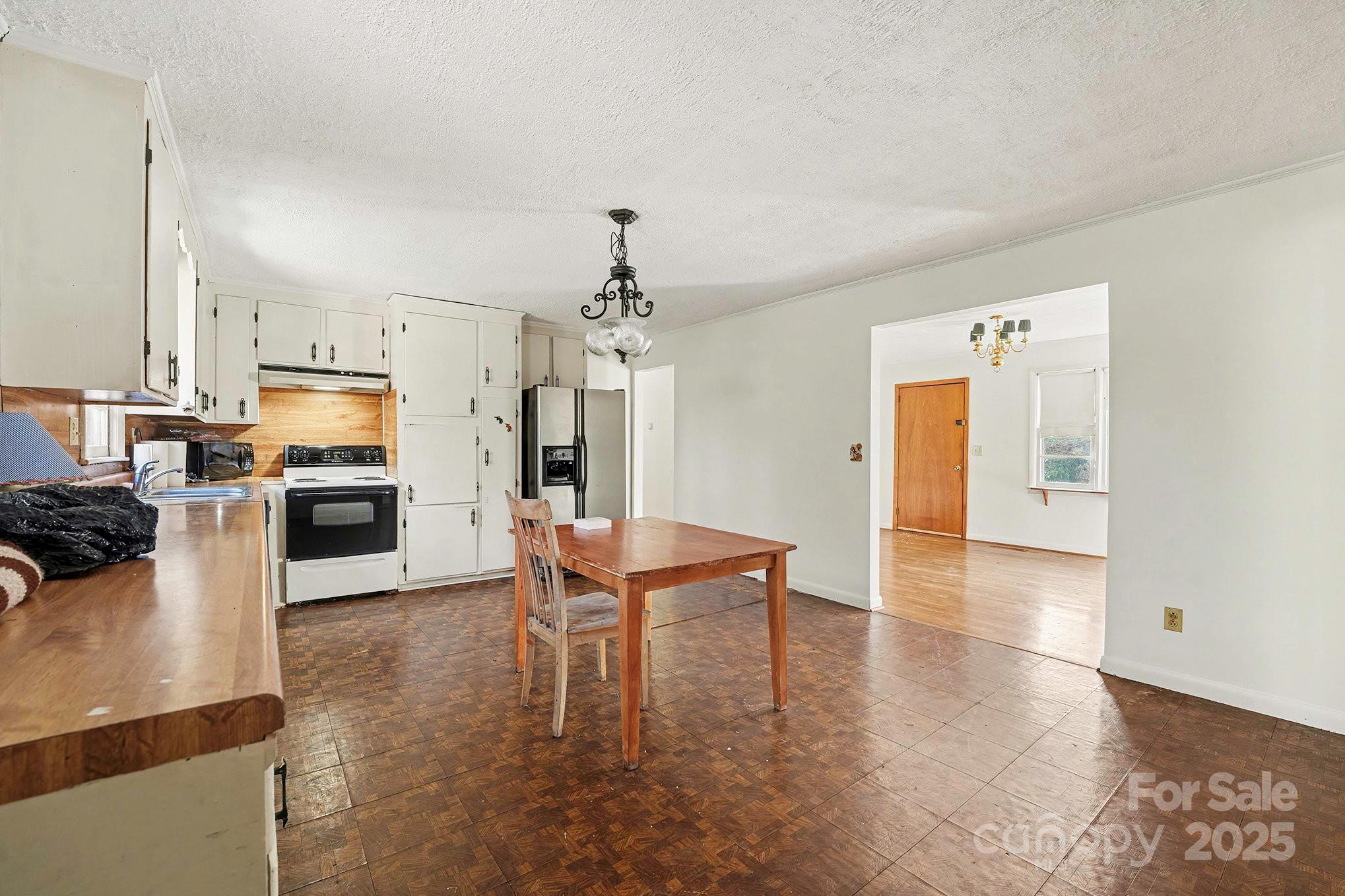 3442 Lester Street Conover, NC 28613 - Photo 12 of 38 a view of a kitchen with dining table and chairs