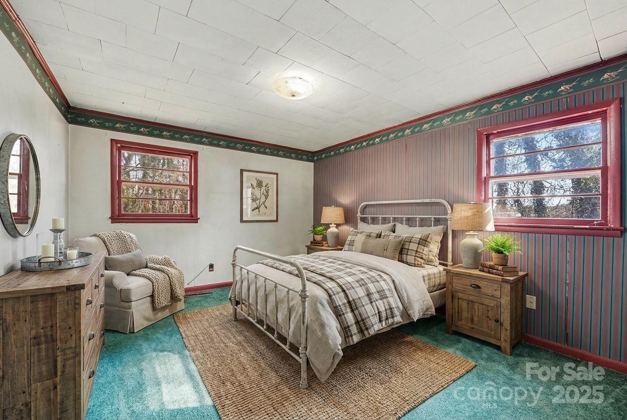 3442 Lester Street Conover, NC 28613 - Photo 13 of 38 a bedroom with a bed and a large window